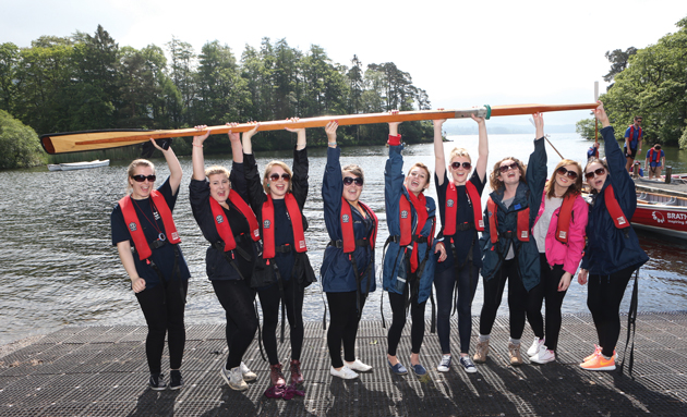 The all-girl South Worcestershire College team lift a whaling boat oar