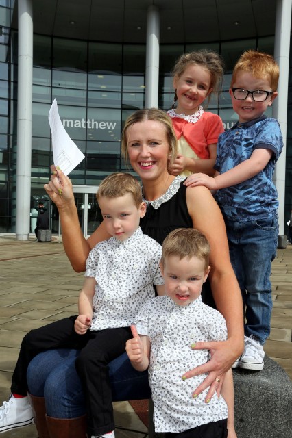 Mary Kate Price, aged 26, will be studying at Cambridge University. She is pictured with her four children -  Eleanor and Ethan, and Alex and Rhys