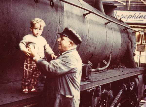 Wright, aged one, with grandfather Ernie, a train driver 