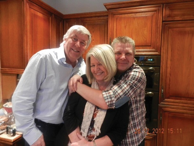 Warner (right) with brother Mike and sister Sue, Christmas 2012