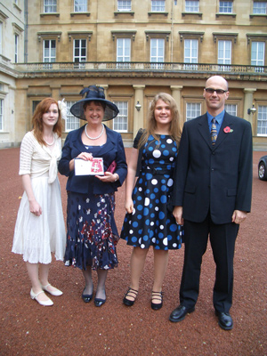 Westerman with daughter Aisling (left), husband Martin and daughter Tanith at the palace in 2010 when Westerman was awarded a CBE