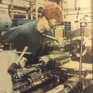 Towse, aged 17, using a lathe as an apprentice engineer