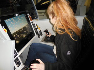 Susanna on board the Warhawk fighter jet simulator