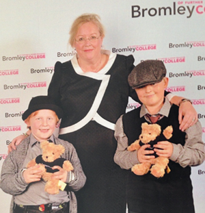 Parrett with, from left, sons, Greg and Ollie at a college award ceremony in December 2014