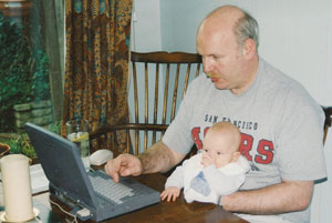 Hatton writing an inspection report in 1997, with help from son Patrick