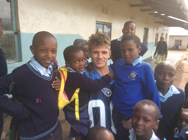 Deaf student Kieron Nugent with the Tanzanian school children