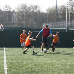 Woodcock takes on the younger generation in a game of football at Barrow park just before the general election this year