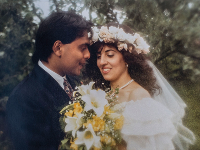 Khan with his wife Julie on their wedding day in June 1990