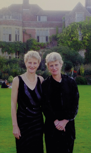 Legrave and her identical twin sister Brigid Simmonds together at a garden party 