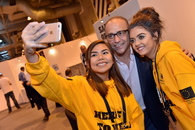 Theo Paphitis poses with Skills Show volunteers for a selfie