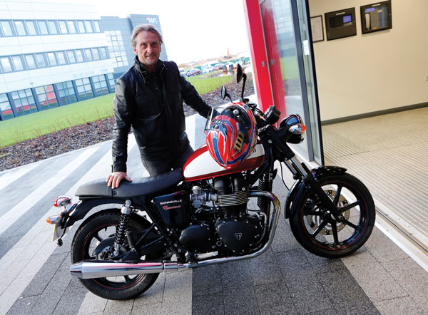 Carl Fogarty with his Triumph motorcycle at the college