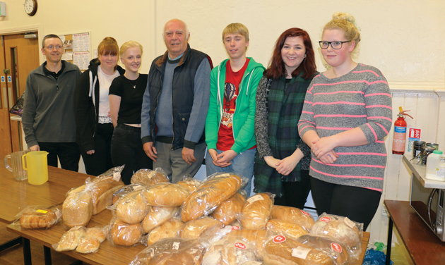 The Hall service-users (seated) with West Nottinghamshire College volunteers. Stood from left: Angus Townsley, Katie Murfitt, Kelsie Berryman, chair of trustees Tony Lee, and fellow volunteers Kate Power and Katie Armstrong