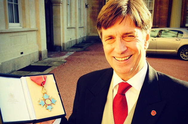 Peter Roberts collecting his CBE