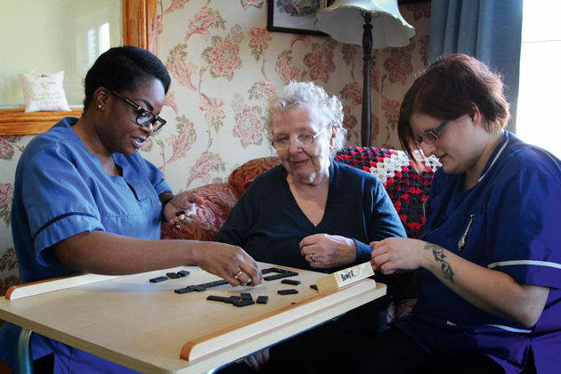 CARING STAFF: Redcar and Cleveland College apprenticeship students Daria Ashton, left, aged 31, and Julia Duncan, right, 36, care for resident of Abbey Care Village, 90 year-old June Stephenson                      