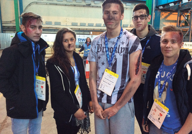 From left: students Liam Brown, aged 16, Leah Warman, 17, Daniel Read, 19, Paulius Kiausinis, 19, and Luke Hunt, 17, just after their make-up had been applied showing various injuries