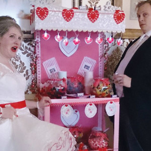 The bride and groom enjoy the sweet trolley at their wedding