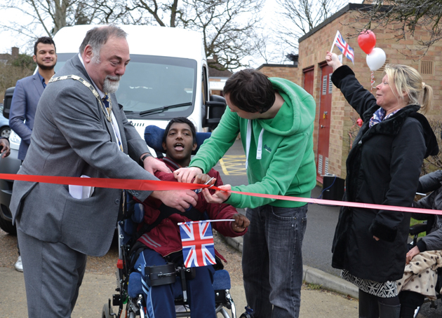 Geoff Austin, Deputy Mayor of Kingston, Orchard Hill College student Nathaniel Arulanandarasa, aged 20, and principal Dr Caroline Allen cut the ribbon to start the race