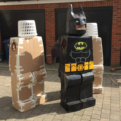 Cardboard and laundry baskets make the perfect superhero