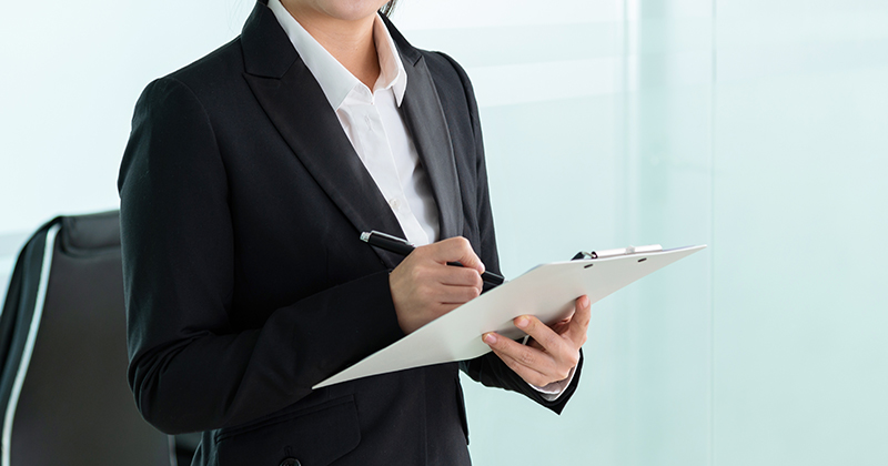 Asian business woman in a modern office | FE Week