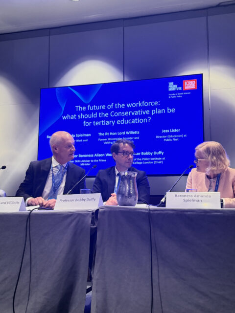 Lords Willetts and Amanda Spielman exchange heated views across a conference panel