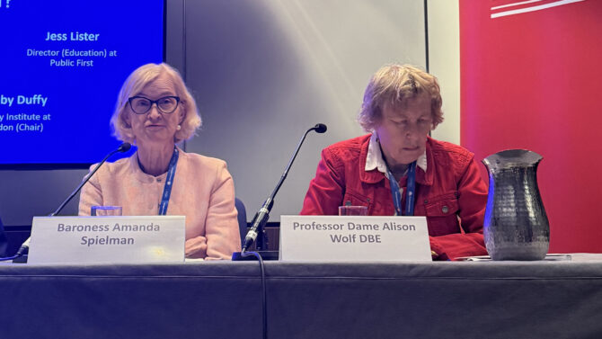 Amanda Spielman and Alison Wolf behind microphones on a panel